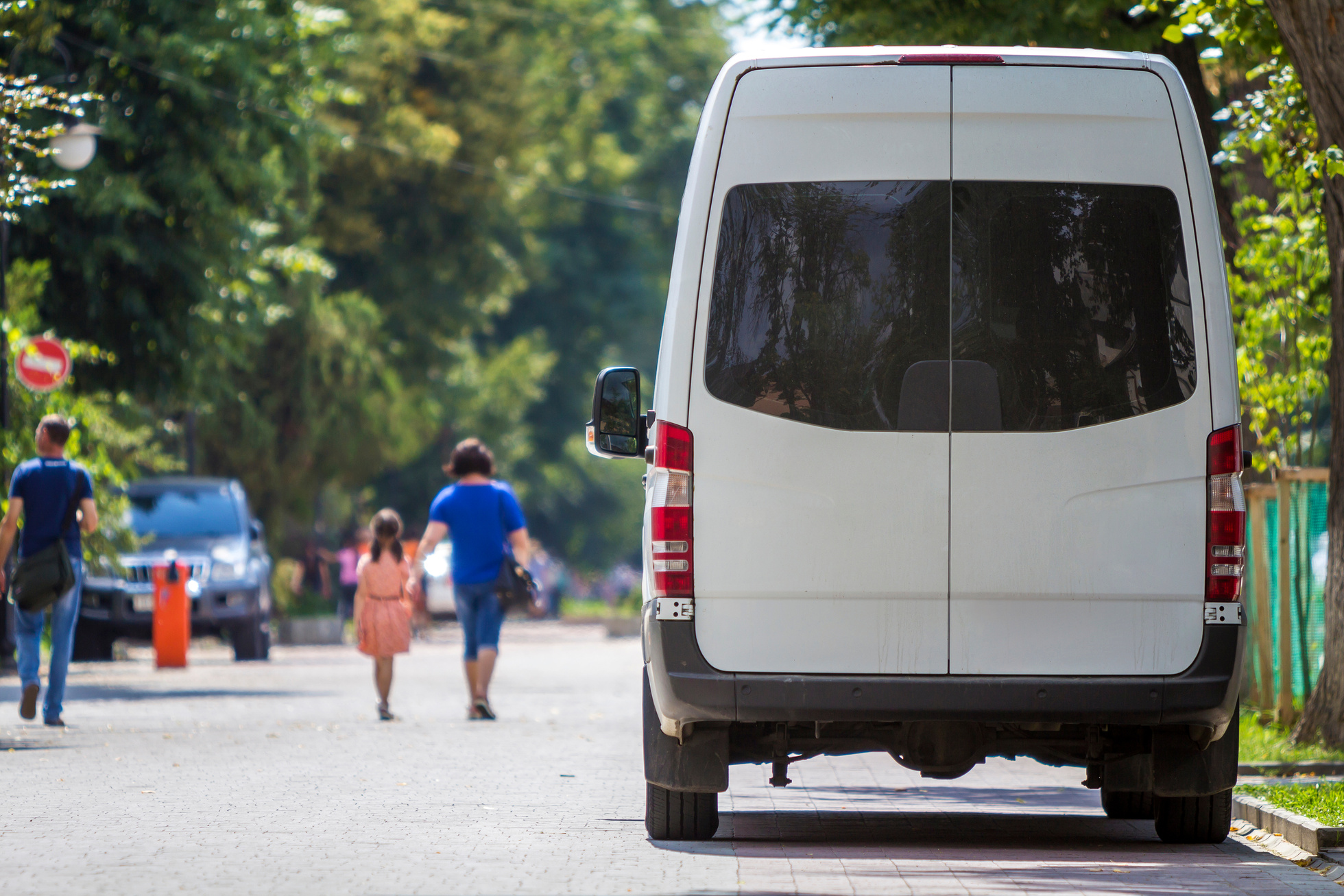 Back view white passenger medium size commercial luxury minibus